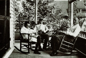 Eugene O'Neill, his brother and father, on the porch of Monte Cristo in Connecticut