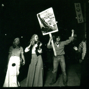 The Chicago Conspiracy Trial, center with sign, beside Kathryn Johnson