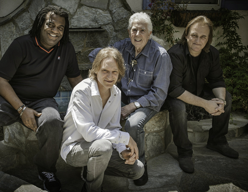 John Mayall and his band: Drummer Jay Davenport, bassist Greg Rzab, Mayall, and guitarist Rocky Athas