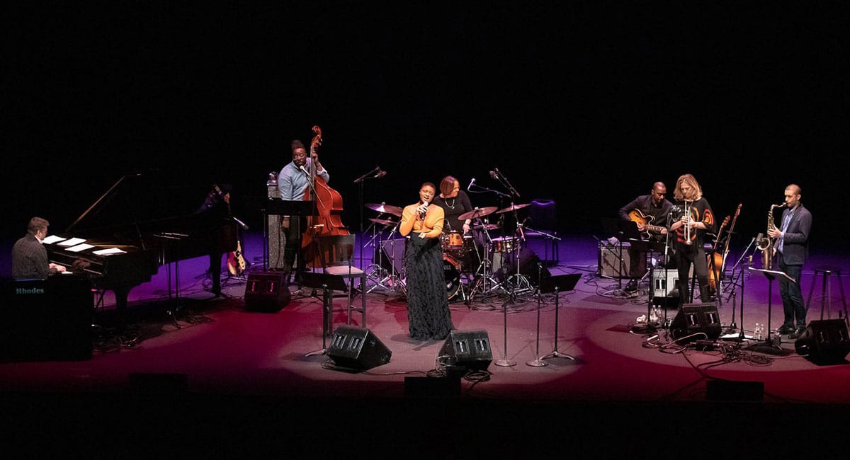 Lizz Wright (center) performs "Edith and the King Pin" in Terri Lyne Carrington's tribute to the music Joni Mitchell, Tina Turner and Nancy Wilson at UCLA on November 9, 2018. Left to right: pianist Jon Cowherd, bassist Solomon Dorsey, Wright, Carrington, guitarist Marvin Sewell, trumpeter Ingrid Jensen and saxophonist Edmar Colon. Photo: ©Reed Hutchinson 2018