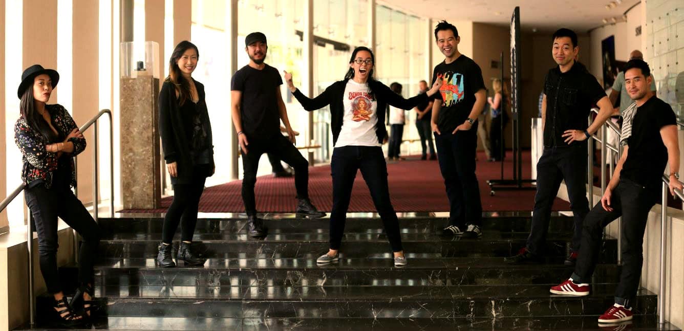 Playwright Lauren Yee flanked by her Rock Band cast on the first day of rehearsal: (from left) Brooke Ishibashi, Jane Lui, Abraham Kim, Joseph Ngo, Daisuke Tsuji and Raymond Lee. (Danielle Bliss/SCR)