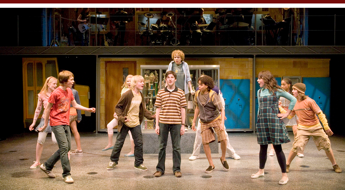 Ricky Astley (stripes), center, Tyler Mann (behind him), and cast members in '13' by Jason Robert Brown and Dan Fish at the Mark Taper Forum, photo by Craig Schwartz